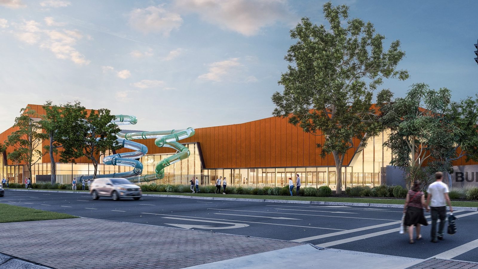 artist impression of new aquatic centre viewed from the main road with two large waterslides featuring on the building.