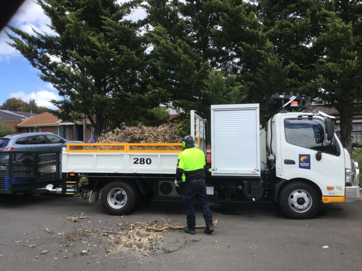 A Council truck full of wood from trees cleared after recent storms in Brimbank.