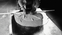 Black and white photograph of traditional pastry making