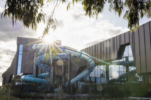 Shows the sun shinning on the outdoor part of the big slide at the Brimbank Aquatic and Wellness Centre.